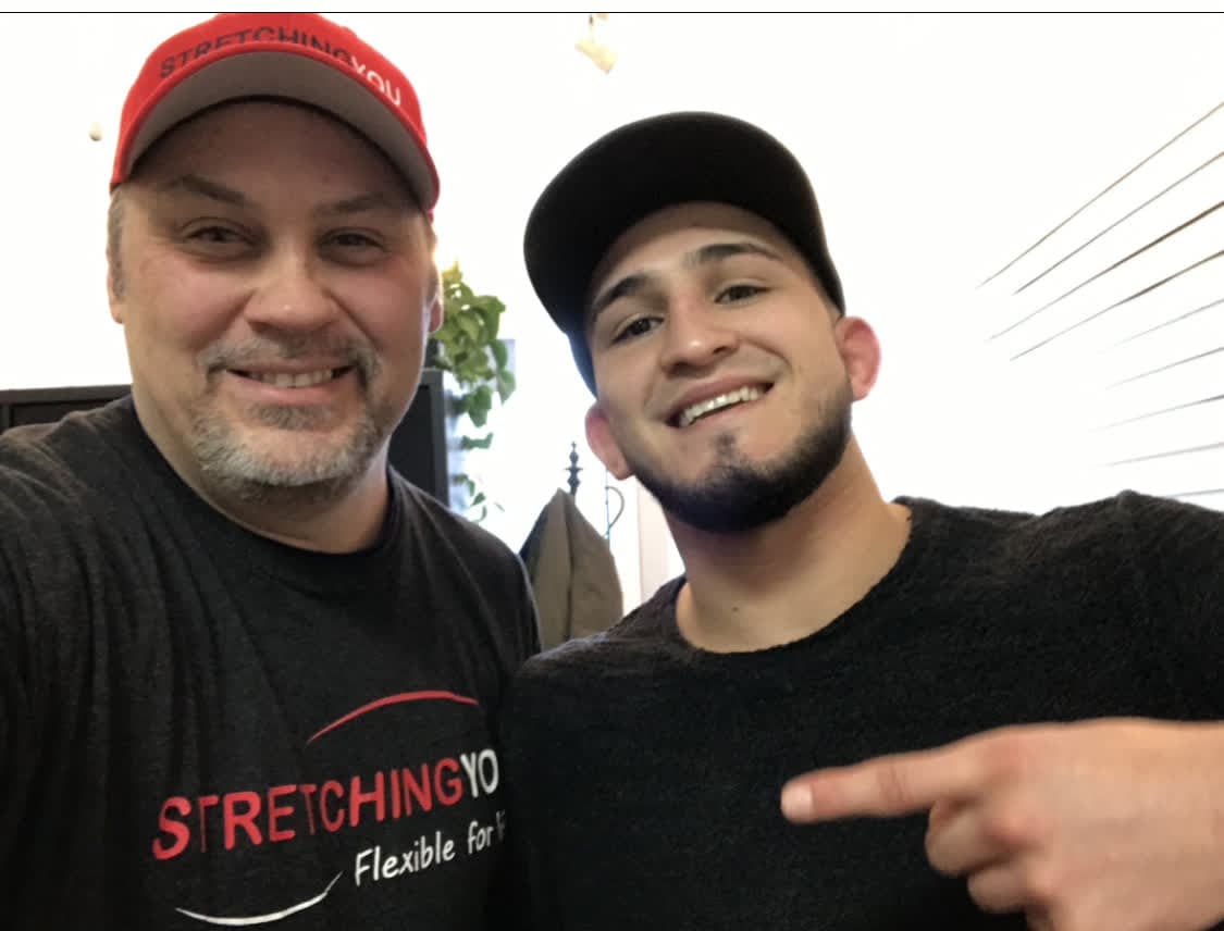 Sergio Pettis with a Strrretch practitioner